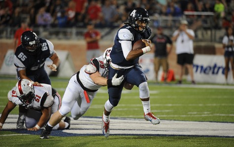 Quarterback Seth Green breaks a tackle on his way to the endzone 