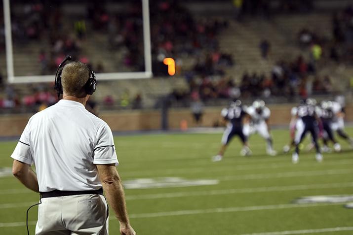 Coach Gambill overlooking his team on the field. (Tate Peterson)