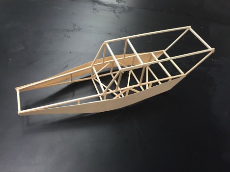 A wooden model of a proposed frame for the solar car.