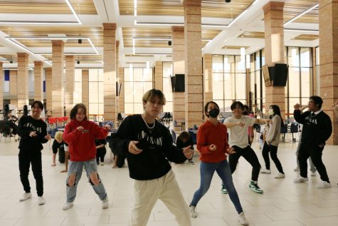 Invision officers practice their part of the Indigo choreography at the end of the routine.