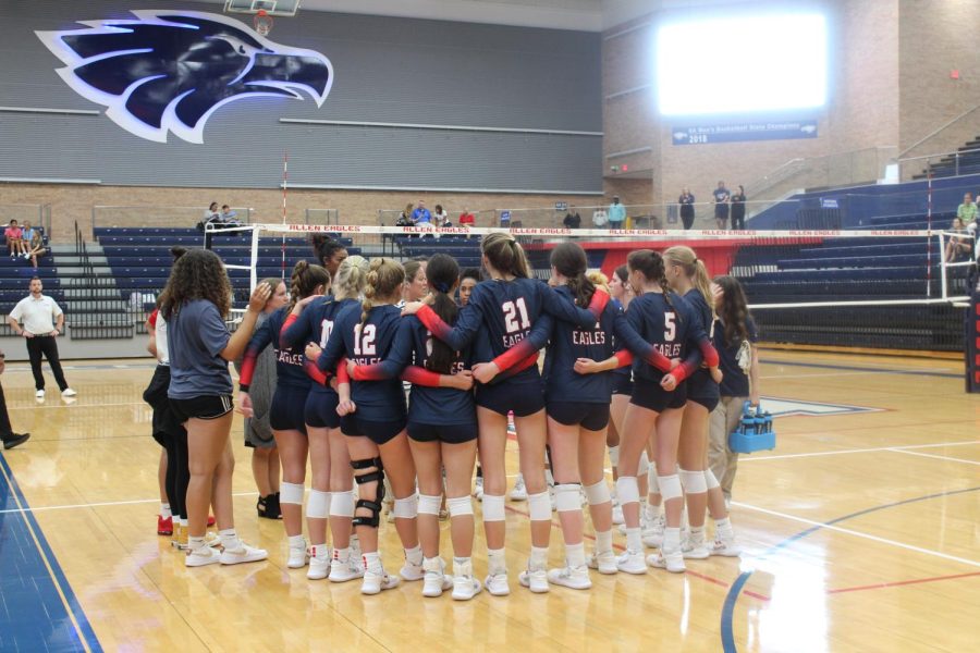 The+Allen+Eagles+High+School+Volleyball+team+have+a+team+huddle+before+their+game+against+the+Trinity+Christian+Academy+Trojans+on+Aug.+23.+%E2%80%9CWe+really+want+to+be+district+champions+and+make+it+to+playoffs%2C%E2%80%9D+Zhang+said.+%E2%80%9CIt%E2%80%99s+kinda+known+that+Allen+volleyball+gets+out+first+round+of+playoffs+every+year+so+we+really+want+to+make+it+past+that.%E2%80%9D+Their+next+game+is+Sept+13.+Against+the+Braswell+High+School+Bengals%2C+with+JV+at+5%3A30+p.m.+and+varsity+at+6%3A30+p.m.+at+Braswell+High+School.