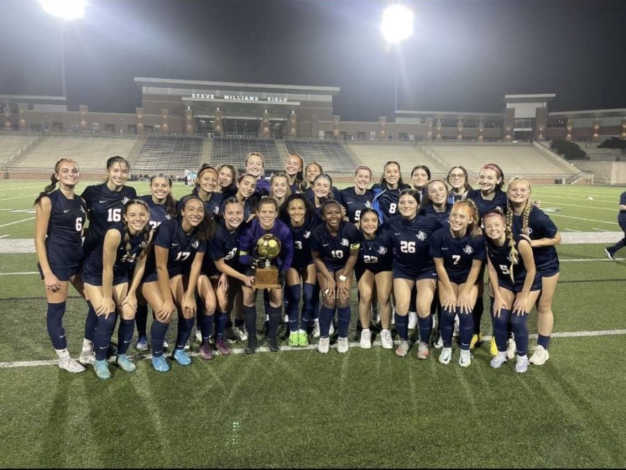 The Lady Eagles taking a team photo after their win against Prosper.