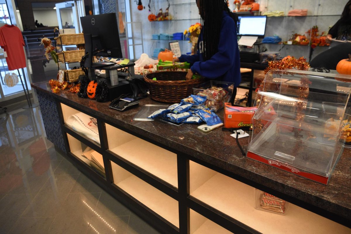 Eagle Edge student employee stocking snacks. Photo Credit: Kie Binion