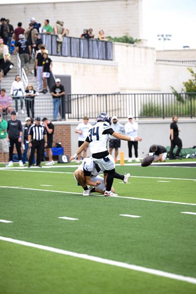 Senior Preston Hurless kicks the ball during the Allen vs. Prosper football game, Friday, Oct. 24, 2025.